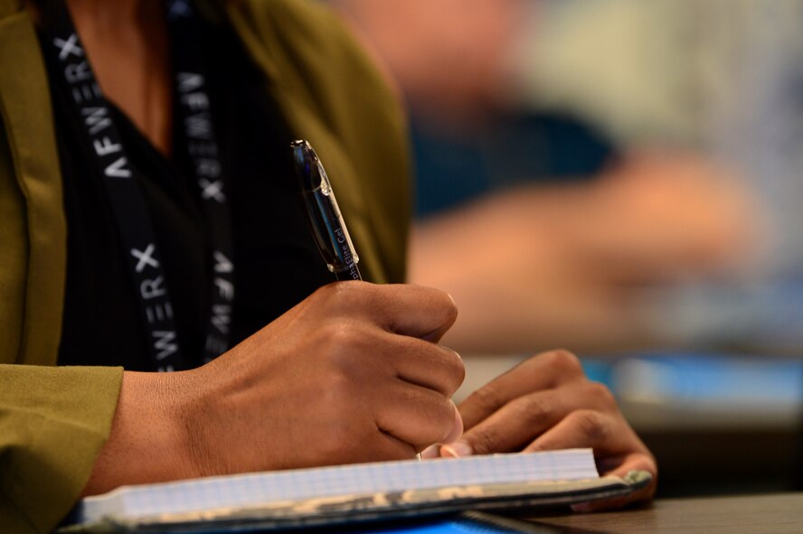 Tech. Sgt. Courtney, 799th Security Forces Squadron security forces member, takes notes during an AFWERX Spark Cell workshop Nov. 5, 2018, in Las Vegas. Airmen visited to spark innovation and explore creative solutions to tactical-level problems. (U.S. Air Force Photo by Airman 1st Class Haley Stevens)