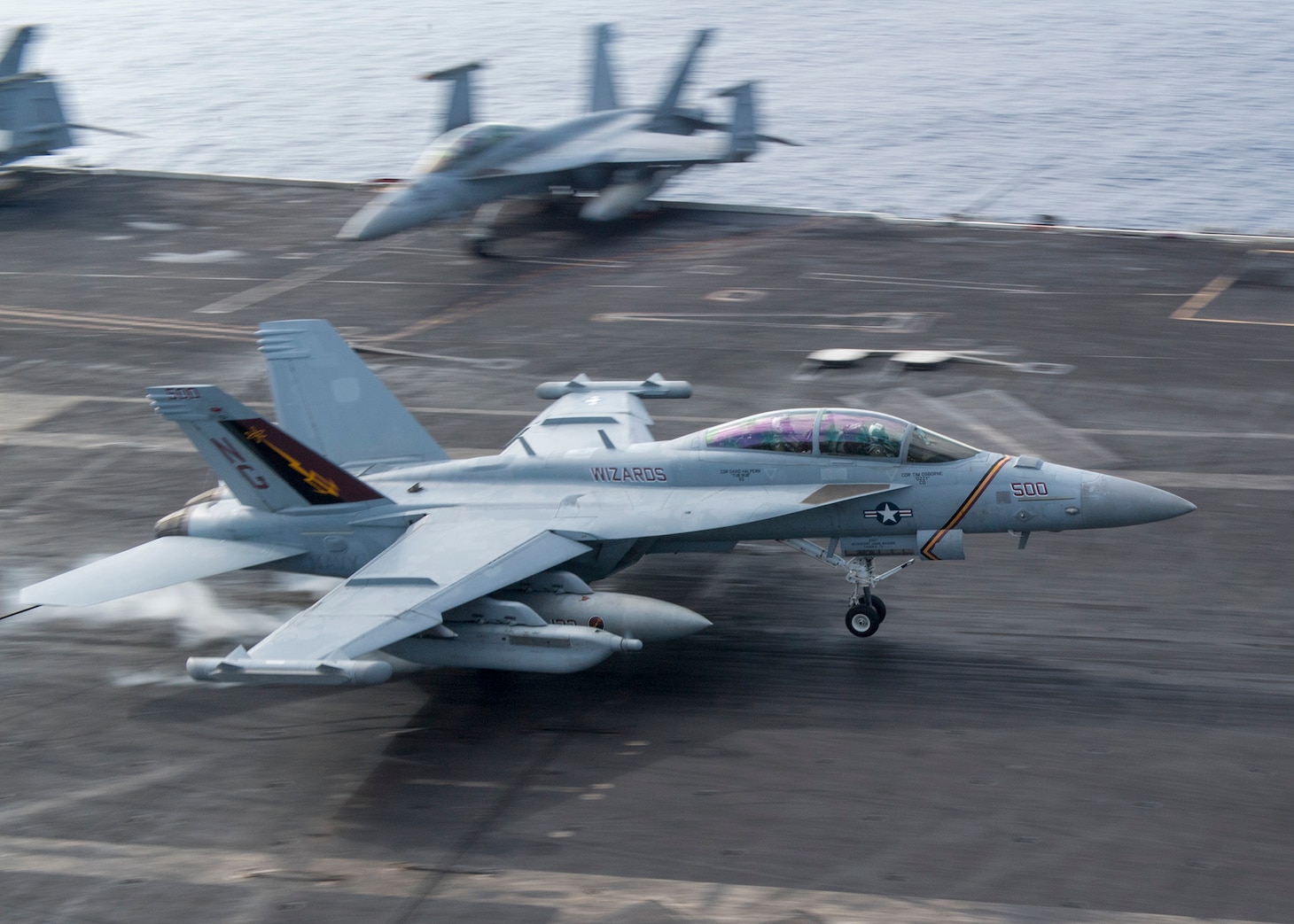 PHILIPPINE SEA (Nov. 13, 2018) An F/A-18G Super Hornet, assigned to the “Wizards” of Electronic Attack Squadron (VAQ) 133, from Carrier Air Wing 9, lands on the flight deck of the aircraft carrier USS Ronald Reagan (CVN 76). USS Ronald Reagan and USS John C. Stennis (CVN 74) are underway and conducting operations, in international waters as part of a dual carrier strike force exercise. The U.S. Navy has patrolled the Indo-Pacific region routinely for more than 70 years promoting regional security, stability, and prosperity. (U.S. Navy photo by Mass Communication Specialist 1st Class Richard L.J. Gourley)