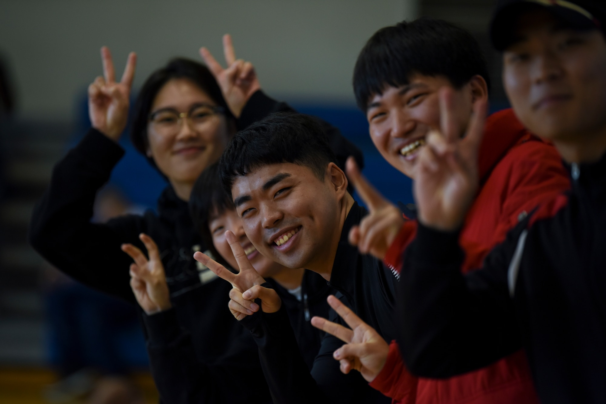 Republic of Korea Air Force 38th Fighter Group members cheer on athletes during the 2018 US-ROKAF Friendship Day at Kunsan Air Base, Republic of Korea, Nov. 9, 2018. The US-ROKAF Friendship Day focused on celebrating the partnership and alliance between the 8th Fighter Wing and 38th Fighter Group, who participated in several events throughout the day. (U.S. Air Force photo by Senior Airman Savannah L. Waters)
