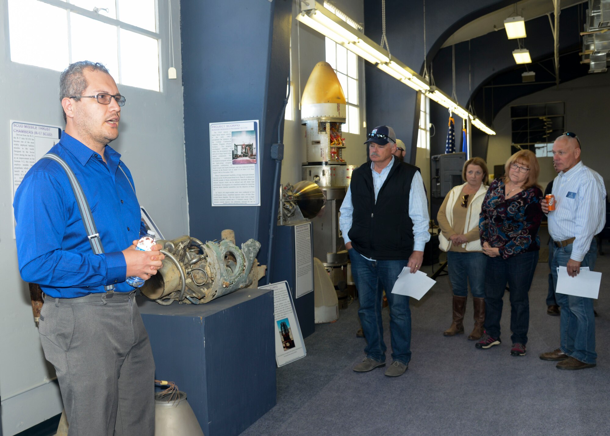 Nils Sedano, Air Force Research Laboratory, Engines Branch technical advisor, gives a tour of the AFRL “Rocket Laboratory’s” Heritage Room during an Honorary Commanders tour at Edwards Air Force Base, California, Nov. 9 (U.S. Air Force photo by Giancarlo Casem)