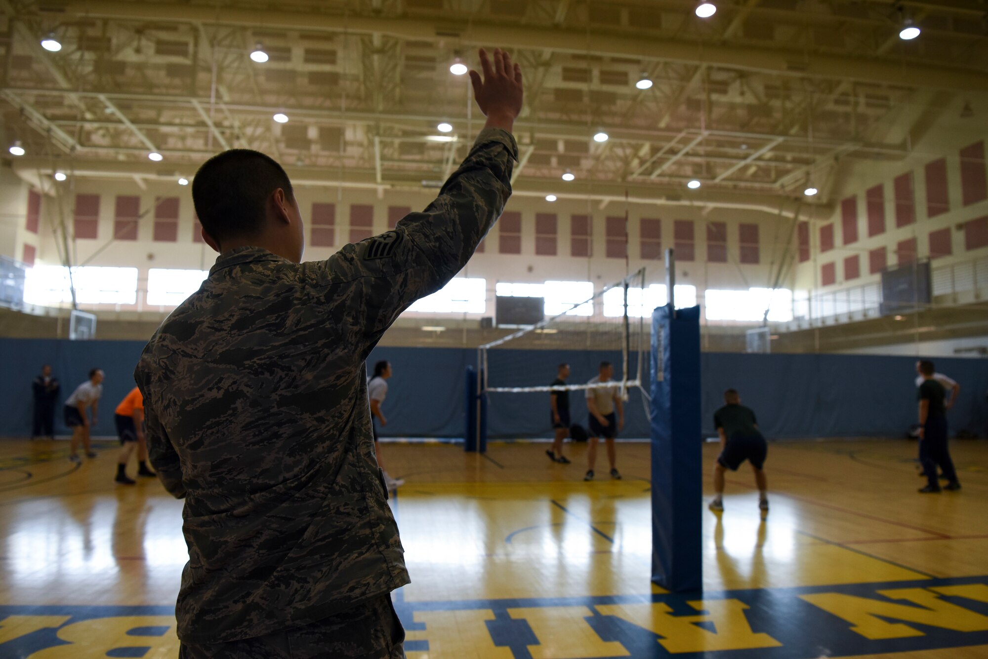 U.S. Air Force Staff Sgt. Bach Nguyen, 8th Maintenance Squadron structural maintainer, referees a volleyball game during the 2018 US-ROKAF Friendship Day at Kunsan Air Base, Republic of Korea, Nov. 9, 2018. Participants competed in a variety of sports and interactive events, such as basketball, volleyball, League of Legends, golf, bowling, and soccer. (U.S. Air Force photo by Senior Airman Savannah L. Waters)