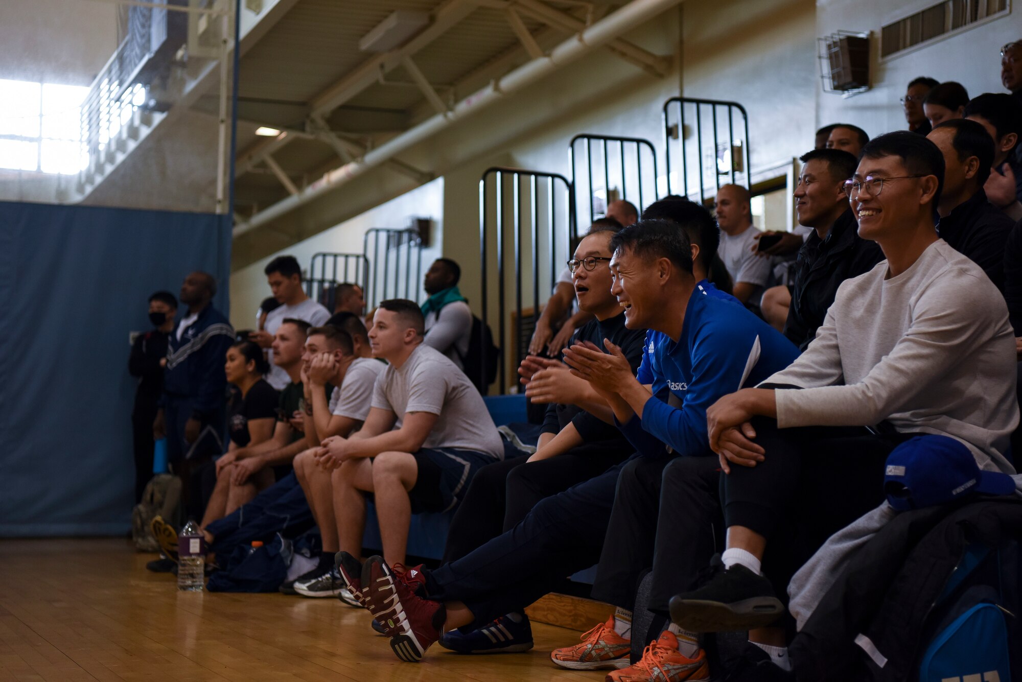 Airmen from the 8th Fighter Wing and 38th Fighter Group cheer on athletes during the 2018 US-ROKAF Friendship Day at Kunsan Air Base, Republic of Korea, Nov. 9, 2018. The US-ROKAF Friendship Day focused on celebrating the partnership and alliance between the 8th Fighter Wing and 38th Fighter Group, who participated in several events throughout the day. (U.S. Air Force photo by Senior Airman Savannah L. Waters)