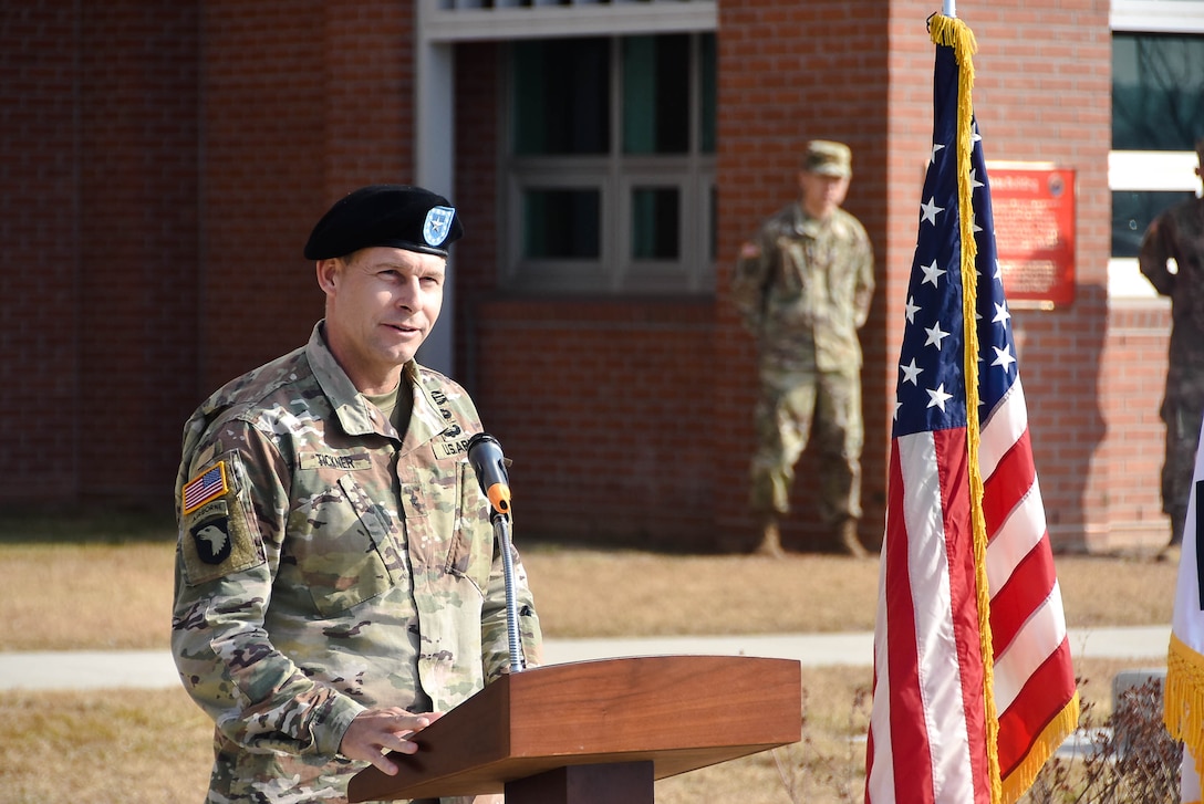 Col. Teresa Schlosser (right), U.S. Army Corps of Engineers (USACE), Far East District (FED) commander, and Richard Byrd (left), USACE FED Deputy District Engineer, prepare to unfurl the unit's colors during an uncasing ceremony held at the district's headquarters, Camp Humphreys, South Korea, Nov. 14.