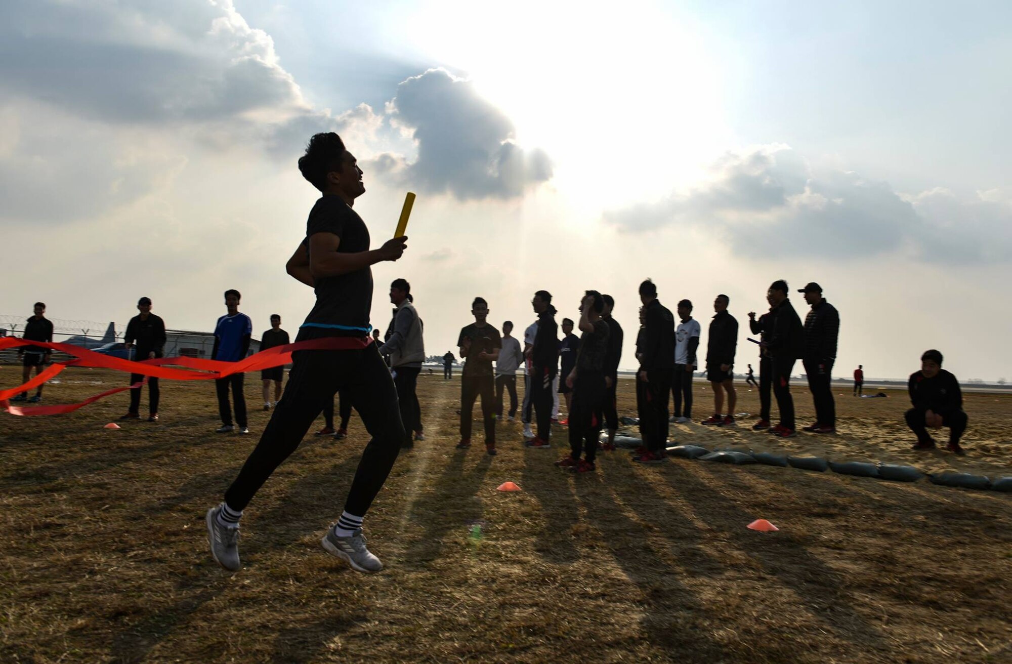 A member from the Republic of Korea Air Force 38th Fighter Group finishes a relay race on Kunsan Air Base, Republic of Korea, Nov. 9, 2018. Participants in the 2018 US-ROKAF Friendship Day competed in a variety of sports and interactive events, such as basketball, volleyball, the video game “League of Legends”, golf, bowling, and soccer. (U.S. Air Force photo by Senior Airman Stefan Alvarez)