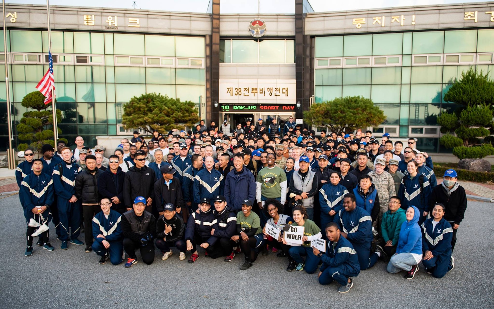 8th Fighter Wing and 38th Fighter Group members pose for a group photo at Kunsan Air Base, Republic of Korea, Nov. 9, 2018. Participants of the 2018 US-ROKAF Friendship day competed in a variety of sports and interactive events, such as basketball, volleyball, the video game “League of Legends,” golf, bowling, and soccer. (U.S. Air Force photo by Senior Airman Stefan Alvarez)