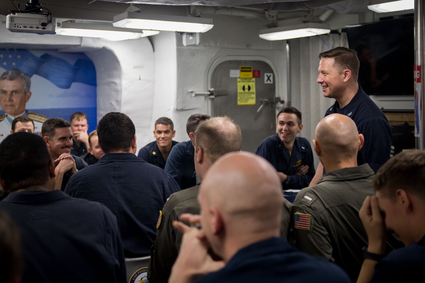PHILLIPINE SEA (Nov. 14, 2018) Capt. Jon Duffy, commander, Destroyer Squadron (DESRON) 15, speaks with chiefs and officers aboard the Arleigh Burke-class guided-missile destroyer USS Stockdale (DDG 106) while conducting dual carrier strike group operations. Stockdale is underway with the aircraft carriers USS Ronald Reagan (CVN 76) and USS John C. Stennis (CVN 74) conducting operations in international waters as part of dual carrier strike force operations. The U.S. Navy has patrolled the Indo-Pacific region routinely for more than 70 years promoting regional security, stability and prosperity