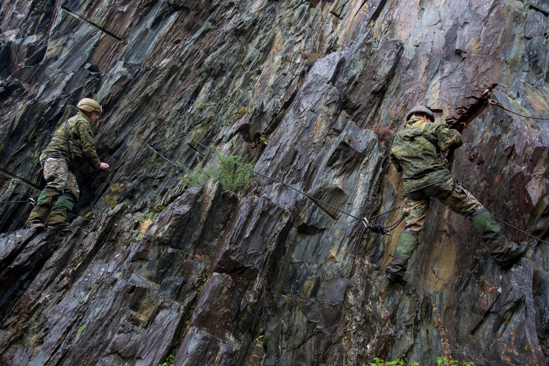 U.S. Marines with Special Purpose Marine Air-Ground Task Force-Crisis Response-Africa maneuver through a vertical assault course during Exercise Green Claymore at Ballachulish Quarry, in Ballachulish, Scotland, Nov. 1, 2018.