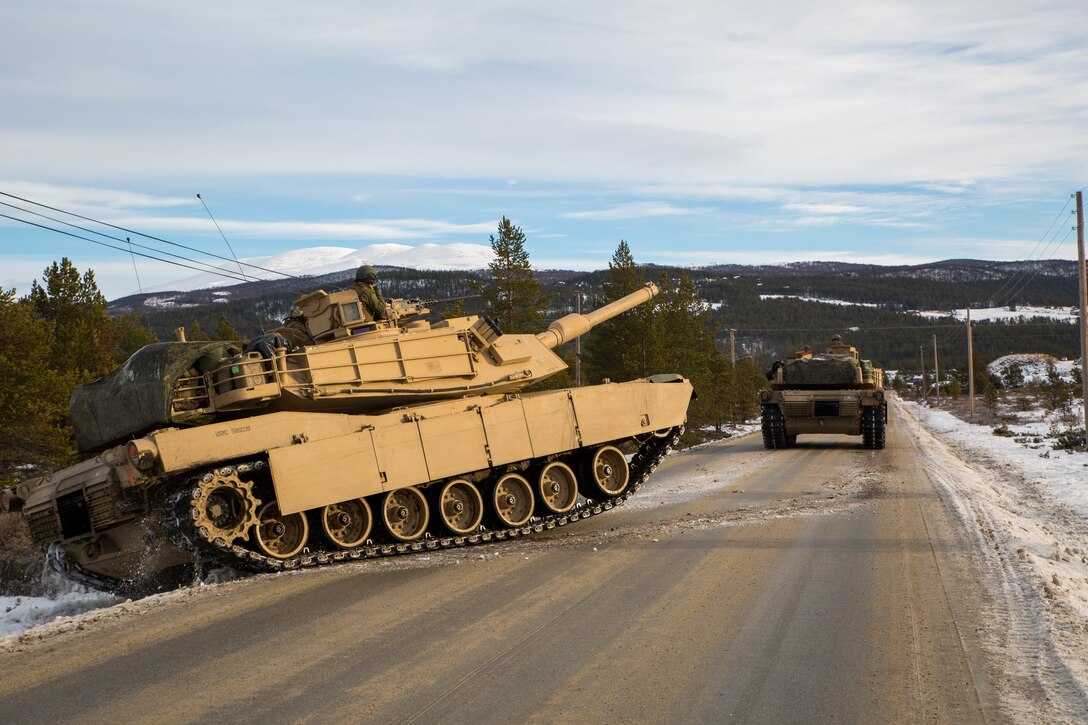 U.S. Marines with 2nd Tank Battalion, 2nd Marine Division, advance towards their eastern objective defended by opposing Spanish forces during Exercise Trident Juncture 18 near Folldal, Norway, Nov. 3, 2018. Trident Juncture 18 enhances the U.S. and NATO Allies’ and partners’ abilities to work together collectively to conduct military operations under challenging conditions. (U.S. Marine Corps photo by Lance Cpl. Menelik Collins/Released)