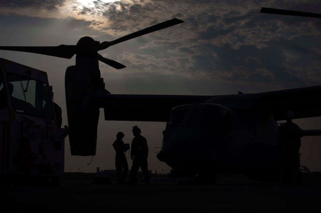 U.S. Marines with Marine Medium Tiltrotor Squadron 166 Reinforced, 13th Marine Expeditionary Unit, maintain an MV-22B Osprey during the Bahrain International Airshow. BIAS, a biennial event, is an opportunity to strengthen military-to-military relationships with regional partners and European allies.