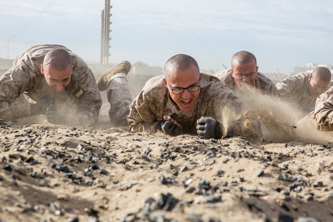 Recruits with Hotel Company, 2nd Recruit Training Battalion, crawl during a combat conditioning exercise at Marine Corps Recruit Depot San Diego, Nov. 14. Physical training is utilized to strengthen the body and develop a strong character embodying our core values through teamwork. Annually, more than 17,000 males recruited from the Western Recruiting Region are trained at MCRD San Diego. Hotel Company is scheduled to graduate Jan. 16.
