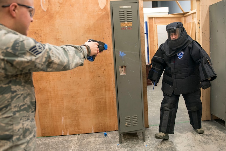 U.S. Air Force Staff Sgt. Thomas Hartline, 100th Security Force Squadron base defense operations controller, tases U.S. Air Force Senior Airman Kory Bruner, during training at RAF Mildenhall, England, Nov. 8, 2018. At the minimum, Airmen on duty are required to don a baton, and have the option to carry a Taser. (U.S. Air Force photo by Staff Sgt. Christine Groening)