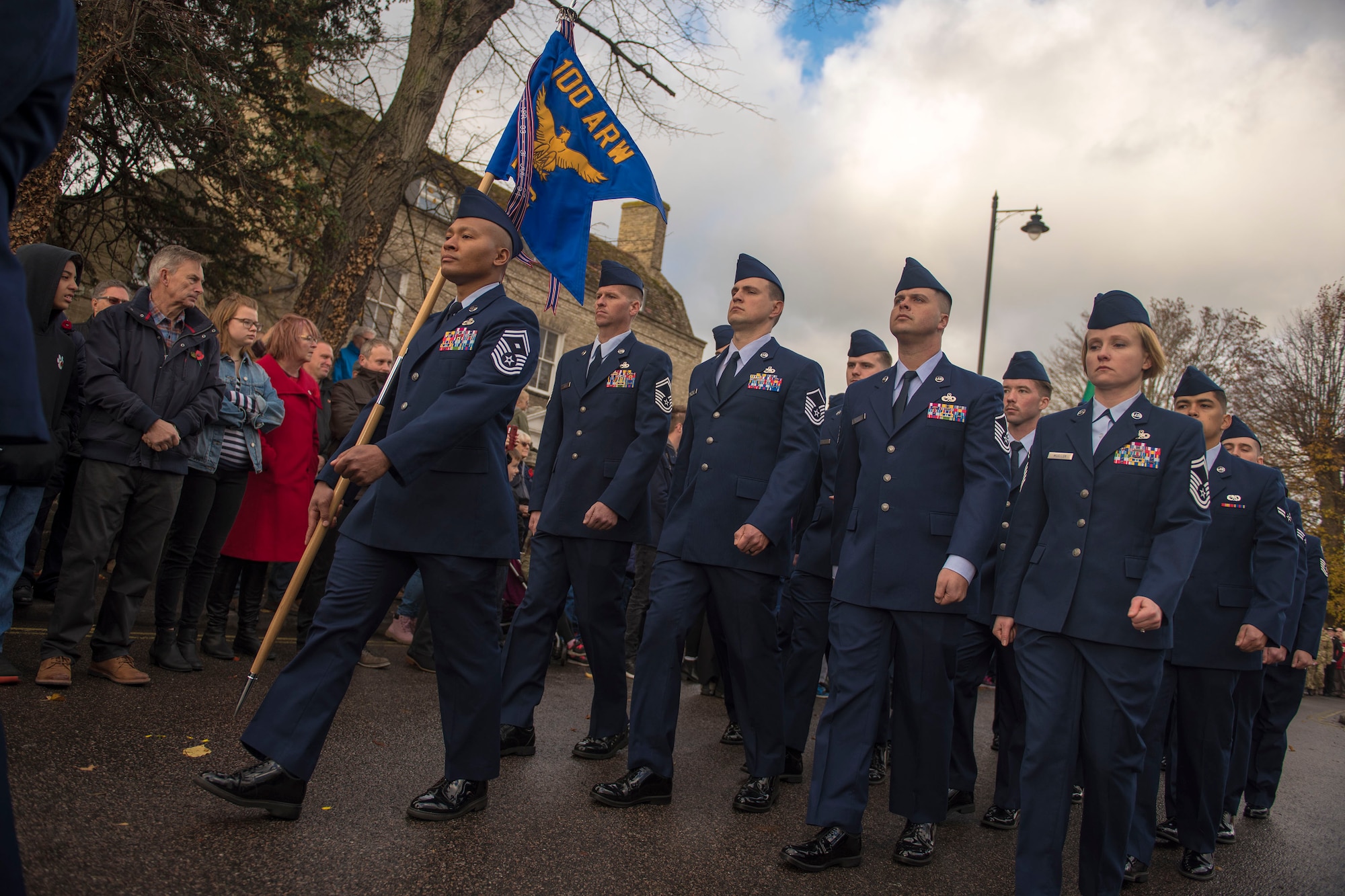 U.S. Air Force Airmen from the 100th Air Refueling Wing march in formation during a Remembrance Day ceremony in Mildenhall, England, Nov. 11, 2018. Airmen, civic leaders, military cadets and others gathered to honor members of the armed services who have died in the line of duty. (U.S. Air Force photo by Staff Sgt. Christine Groening)