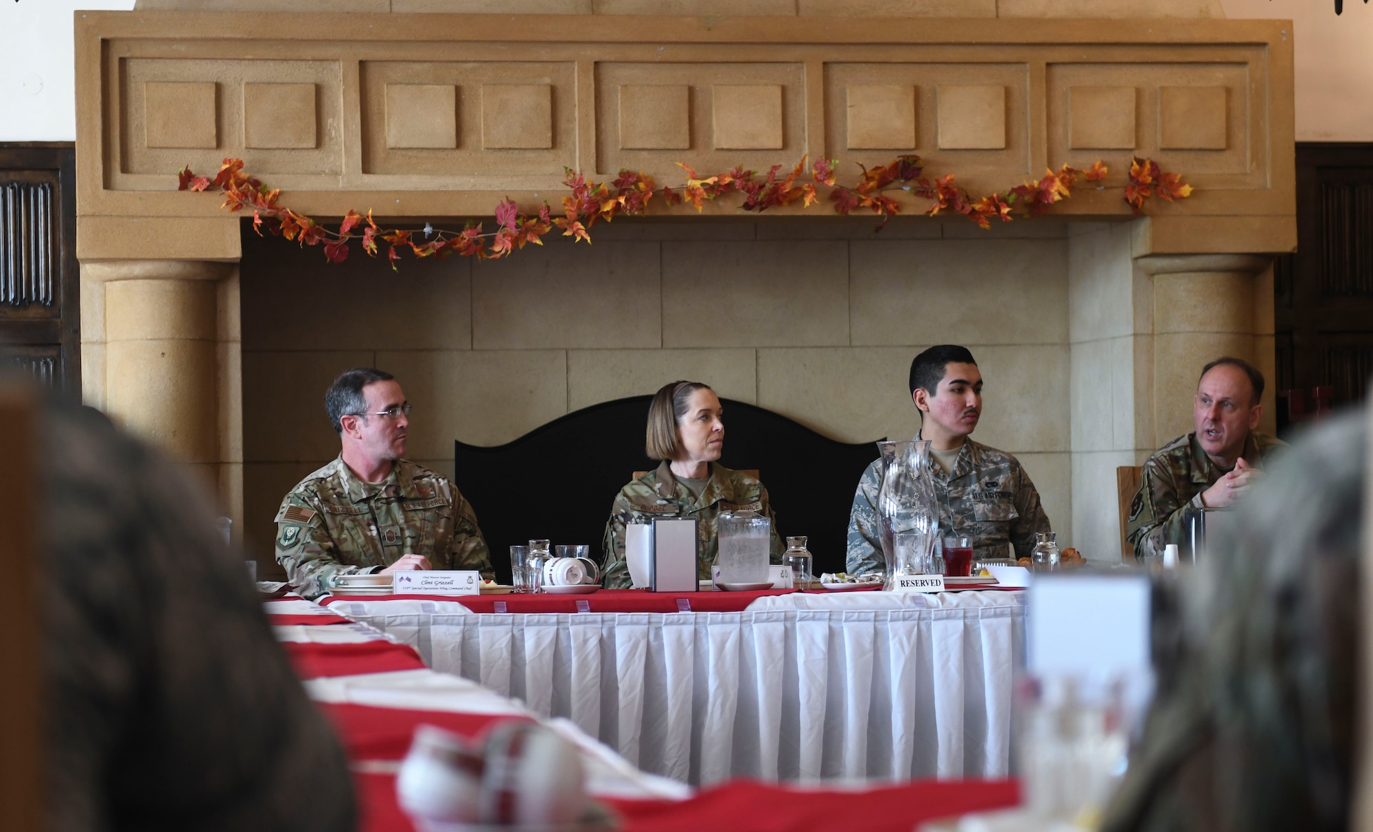 U.S. Air Force Air Education and Training Command command chiefs speak with first-term and newly retrained Airman during lunch to learn their perspective of the training process at RAF Mildenhall, England, Nov. 14, 2018. The purpose of their visit was to speak with Airmen and gain a better understanding of what they do to support Team Mildenhall, AETC and Air Force Special Operations Command. (U.S. Air Force photo by Airman 1st Class Alexandria Lee)