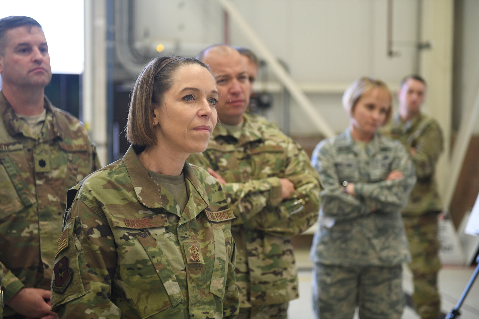 U.S. Air Force Chief Master Sgt. Juliet Gudgel, Air Education and Training Command command chief, listens to the 100th Maintenance Squadron’s presentation of an innovation to show how they sustain mission effectiveness at RAF Mildenhall, England, Nov. 14, 2018. Chief Gudgel visited RAF Mildenhall to speak with Airmen and gain a better understanding of what they do to support Team Mildenhall, AETC and Air Force Special Operations Command. (U.S. Air Force photo by Airman 1st Class Alexandria Lee)