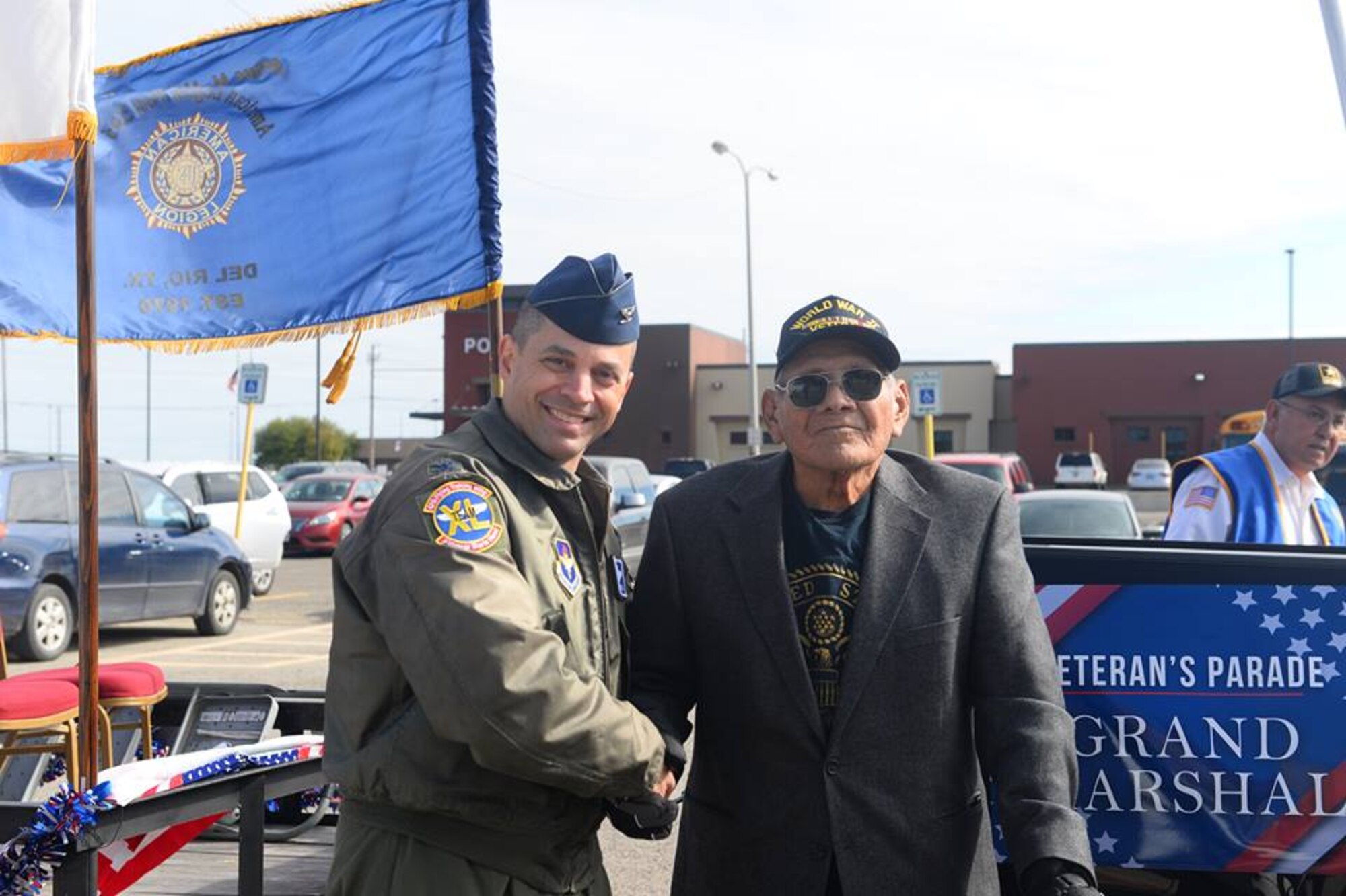 Col. Lee Gentile, 47th Flying Training Wing commander, shakes hands with a World War Two veteran during a Veteran’s Day Parade at Del Rio, Texas, Nov. 11, 2018. Laughlin Air Force, Base, Texas, and the local community of Del Rio, Texas, got together to celebrate all who have served through the town’s tradition of a Veteran’s Day Parade. The parade contained many floats featuring not only representatives of Laughlin, but also various veterans’ organizations, vans and ROTC units.