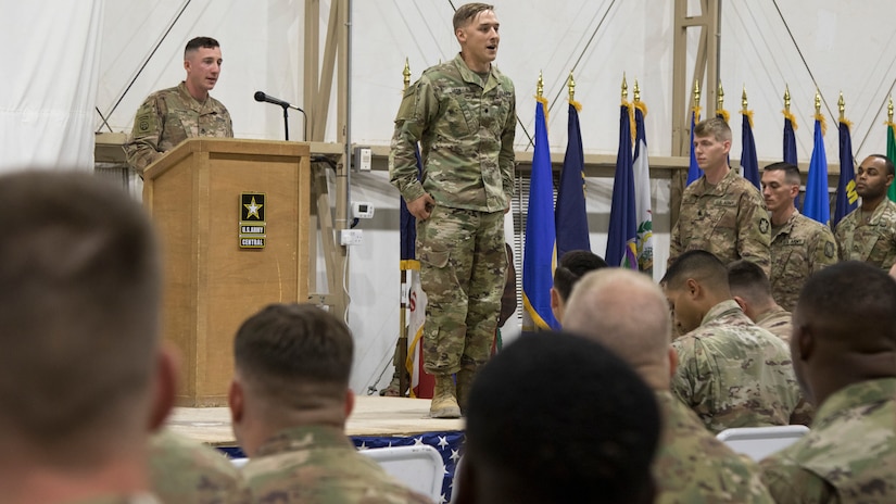 A U.S. Army Soldier graduating from the latest Basic Leader Course at the U.S. Army Central Noncommissioned Officer Academy calls out his name before he walks across the stage at the graduation ceremony held in Camp Buehring, Kuwait, Oct. 17, 2018. The graduates will return to their deployed units as more capable Soldiers, prepared for leadership positions.