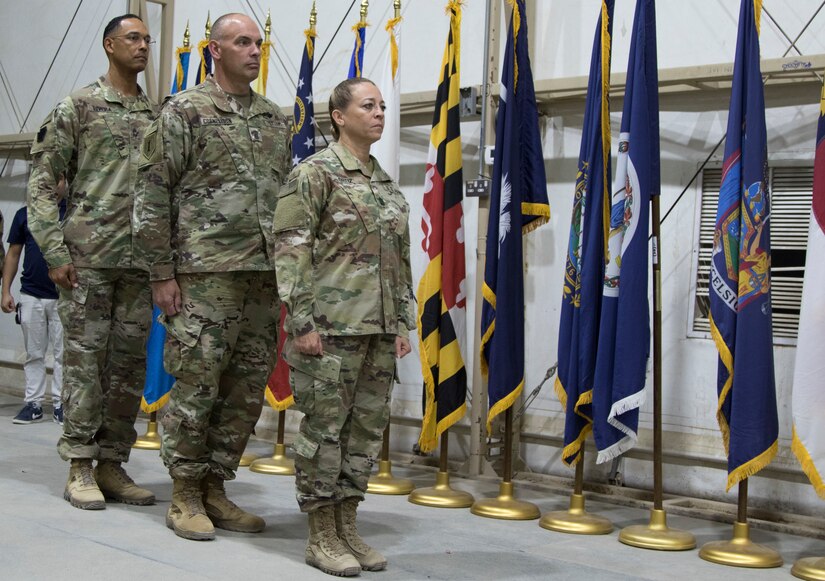 From left, U.S. Army Master Sgt. Otoniel Rivera, Chief of Training for the Camp Buehring Noncommissioned Officer Academy, U.S. Army Command Sgt. Maj. Barry Parker, command sergeant major of the 150th Brigade Engineer Battalion, and U.S. Army Command Sgt. Maj. Donna Ortiz, commandant of the Camp Buehring NCOA, preside over the newest graduating class of Soldiers from the Basic Leader Course at Camp Buehring, Kuwait, Oct. 17, 2018. The NCOA in Camp Buehring prepares junior Soldiers for leadership positions within their units while deployed overseas.