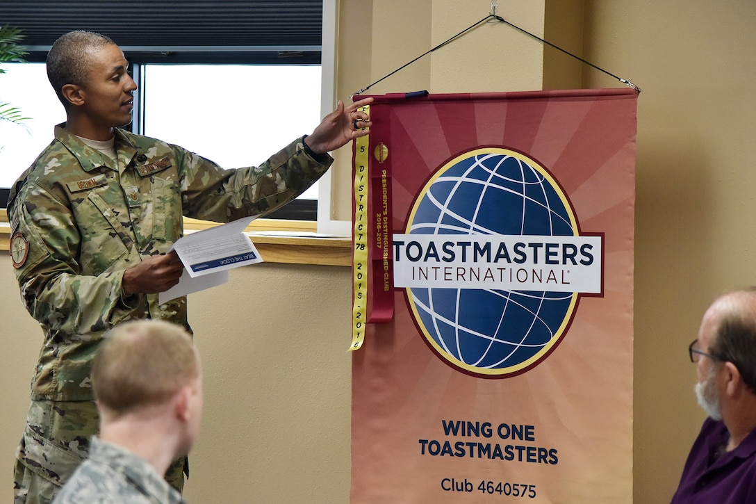 Tech. Sgt. Ritchie Brown, 741st Missile Security Forces Squadron member and Toastmasters president, unveils an accolade Nov. 7, 2018, at Malmstrom Air Force Base, Mont.