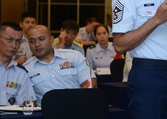 SSgt Jason Sugimoto conveys partner nation messages to WO Yamazaki at the Pacific Rim in 2016.