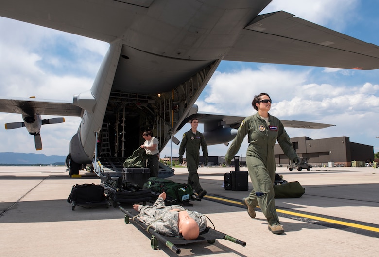 Reserve Citizen Airmen with the 34th Aeromedical Evacuation Squadron train on the flight line at Peterson Air Force Base, Colorado, June 27, 2018.