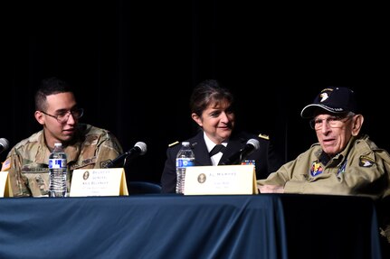 From left to right: U.S. Army National Guard Specialist Henry Torres-Sanchez; U.S. Army Reserve Brig. Gen. Kris. A. Belanger, Commanding General, 85th Support Command, and World War II veteran, Al Mampre, share their military stories during a panel discussion with students during the Elk Grove High School Veterans Day ceremony, Nov. 9, 2018.