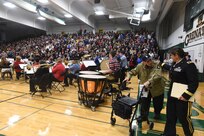 World War II veteran Al Mampre, Easy Company, 506th Infantry Regiment, 101st Airborne Division, enters the Elk Grove High School gymnasium with U.S. Army Reserve Brig. Gen. Kris A. Belanger, Commanding General, 85th Support Command, during the high school’s Veterans Day ceremony, Nov. 9, 2018.