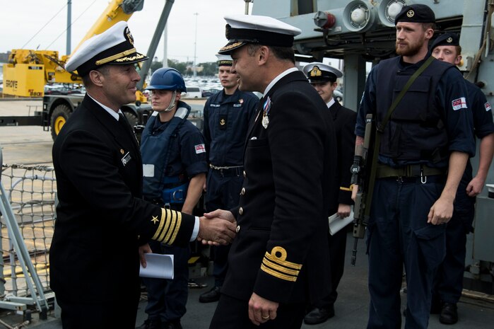 U.S. Navy Capt. Kevin Byrne, Joint Base Charleston deputy commander, greets the HMS Monmouth commanding officer, Cmdr. Will King, during the ship’s visit Nov. 8-12, 2018, at the Port of Charleston. The British Royal Navy ship hosted several events throughout Veterans Day weekend engaging with Charleston's military and civilian leadership.