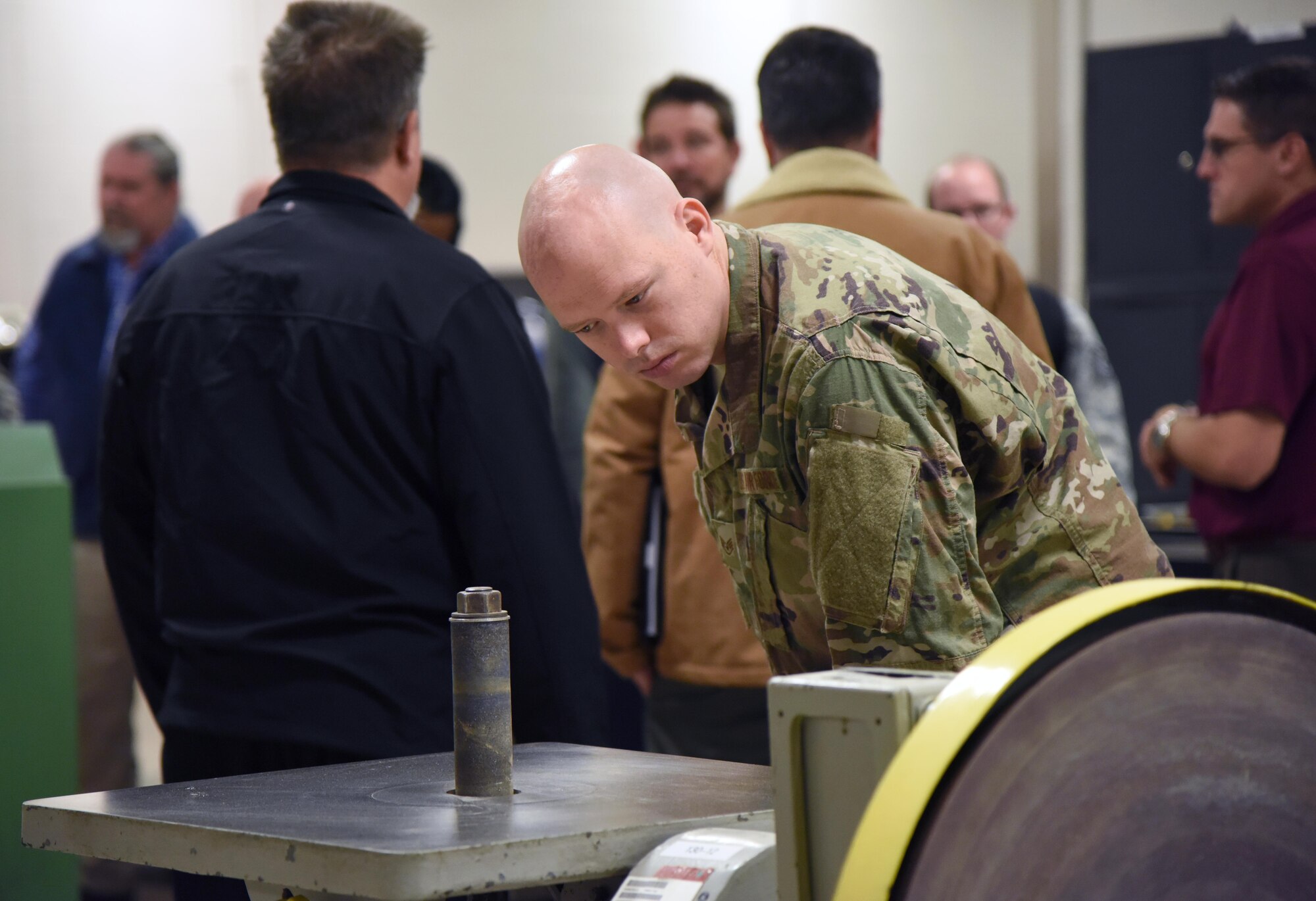 U.S. Air Force Staff Sgt. William Hoffman, 316th Training Squadron instructor, Goodfellow Air Force Base, Texas, inspects equipment used at the Trainer Development Center on Keesler Air Force Base, Mississippi, Nov. 13, 2018. Personnel from Goodfellow AFB, Texas, and Vandenberg AFB, California, visit squadrons within the 81st Training Group to review methodologies currently being used in the 81st TRG course curriculum. (U.S. Air Force photo by Kemberly Groue)
