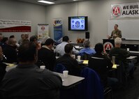 Maj. Cal Gentry, 354th Contracting Squadron commander, briefs Alaskan business leaders at an Interior Alaska Industry Day event in Fairbanks, Alaska, Nov. 14, 2018. The event gathered more than 150 business leaders in order to answer questions, as well as inform and educate on the contracting process with the Federal Government. (U.S. Air Force photo by Capt. Kay M. Nissen)