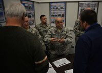 Tech. Sgt. Zachary Bowens, a 354th Contracting Squadron member, talks with Alaskan business leaders at an Interior Alaska Industry Day event in Fairbanks, Alaska, Nov. 14, 2018. The purpose of the industry day was to inform and educate local businesses on the contracting process with the Federal Government. (U.S. Air Force photo by Capt. Kay M. Nissen)