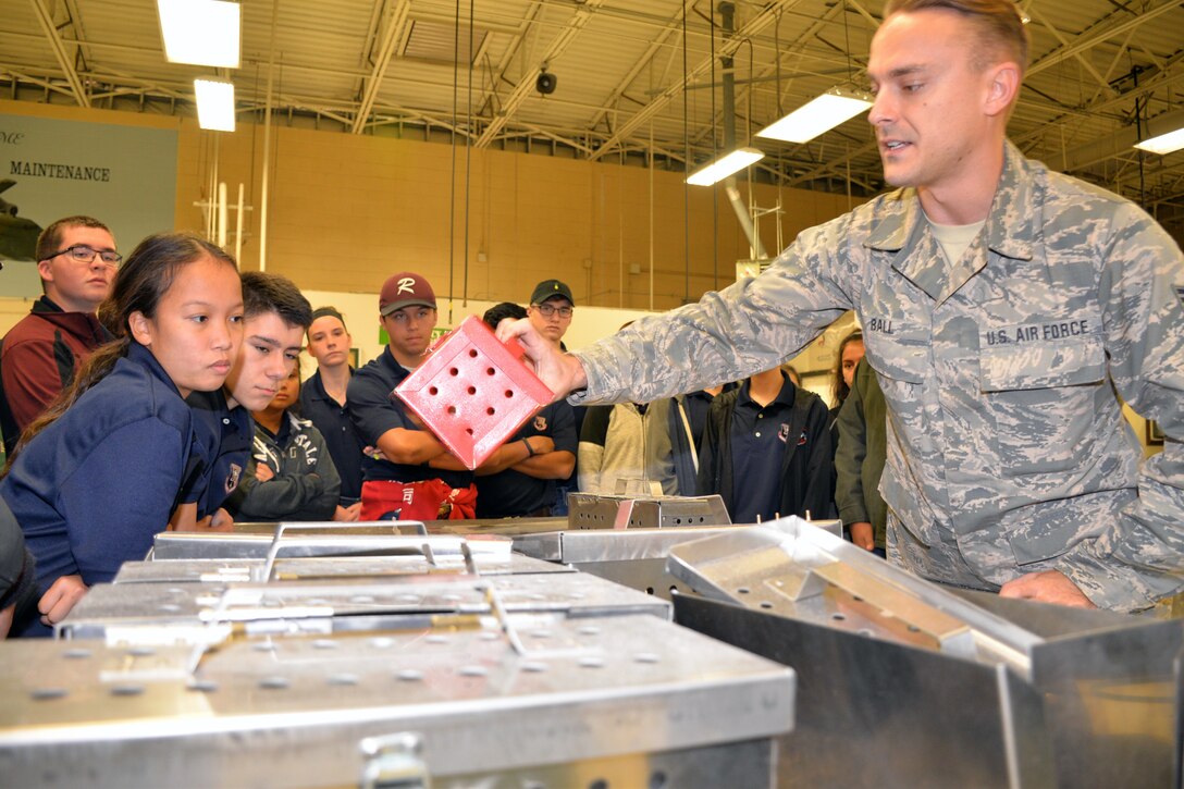 Tech Sgt. Nathaniel D. Ball, 433rd Maintenance Squadron sheet metal mechanic, explains how the Reserve Citizen Airmen in the metals and structural shops create replacement parts for the C-5M Super Galaxy to Rowlett High School Air Force Junior Reserve Officer’s Training Corps cadets at Joint Base San Antonio-Lackland, Texas Nov. 9, 2018.