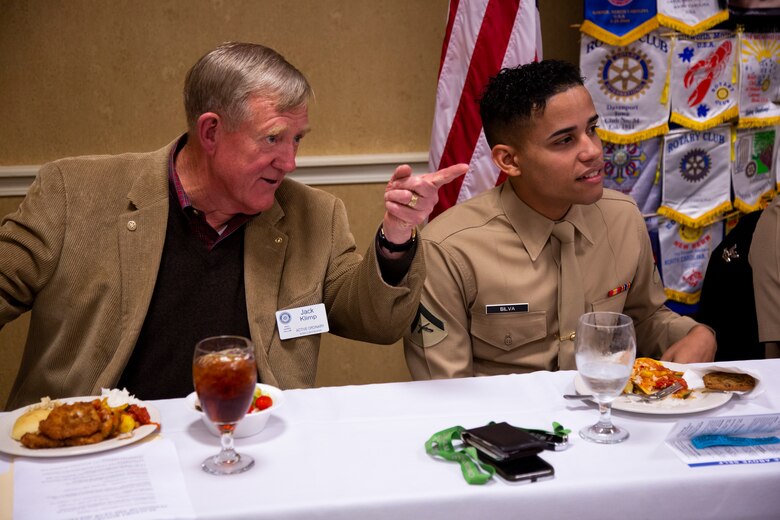 Ret. Lt. Gen. Jack Klimp, with the Beaufort Rotary Club, and Lance Cpl. Carlos Silva, with Headquarters and Service Battalion, Marine Corps Recruit Depot Parris Island, talk during a luncheon before an award ceremony Nov. 14, 2018 in Beaufort, S.C. Silva, from New York, N.Y., was awarded the “Beaufort Rotary Military Persons of the Year” award by the rotary club for being an outstanding Marine and volunteering in the local community. (U.S. Marine Corps photo by Lance Cpl. Carlin Warren)