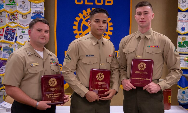 Petty Officer 2nd Class Corey Maywald, left, with Naval Hospital Beaufort, Lance Cpl. Carlos Silva, center, Headquarters and Service Battalion, Marine Corps Recruit Depot Parris Island, and Lance Cpl. Connor Gibson, Marine Corps Air Station Beaufort, pose for a photo during an  award ceremony held in their honor Nov. 14, 2018, in Beaufort, S.C. All three were awarded the “Beaufort Rotary Military Persons of the Year” award by the Beaufort Rotary Club for being an outstanding service member and volunteering in the local community. (U.S. Marine Corps photo by Lance Cpl. Carlin Warren)