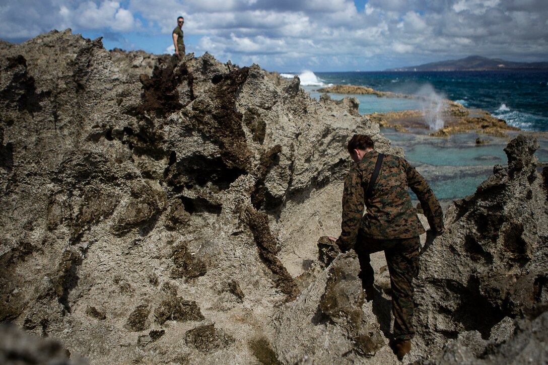 Marines with the 31st Marine Expeditionary Unit visit the ocean side ‘Blowhole’ on Tinian, Commonwealth of the Northern Mariana Islands, Nov. 11, 2018. Marines with the 31st MEU and Combat Logistics Battalion 31 have been leading the multi-service Department of Defense’s Defense Support of Civil Authorities relief efforts here since Oct. 29 in the wake of Super Typhoon Yutu, which wreaked havoc as the second strongest storm to ever hit U.S. soil on Oct. 25. Tinian, host of a 1944 WWII battle during the Marianas Campaign, is part of the U.S. Commonwealth of the Northern Mariana Islands. More than 320 Marines, sailors and soldiers died during the battle here in June and July 1944 as allied forces moved toward Imperial Japan. As a historic battle site, Marines and sailors with both the 31st MEU and CLB-31 spent time exploring the island during the DSCA mission to learn about its significance in American history. (U.S. Marine Corps photo by Gunnery Sgt. T. T. Parish/Released)