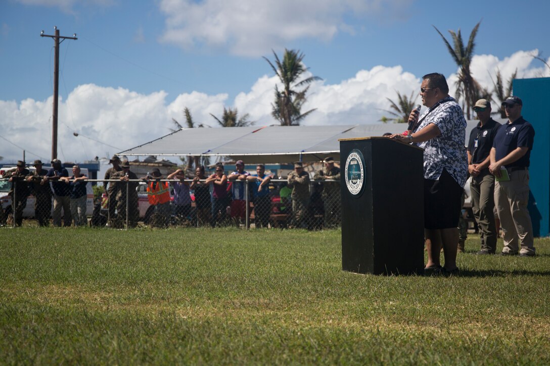 The Honorable Joey P. San Nicholas, mayor of Tinian, thanks the Marines and sailors of the 31st Marine Expeditionary Unit and Combat Logistics Battalion 31 during a ceremony marking the end of the 31st MEU’s mission as part of the U.S. Defense Support of Civil Authorities relief efforts on Tinian, Commonwealth of the Northern Mariana Islands, Nov. 14, 2018. Marines and Sailors with the 31st MEU and CLB-31 assisted the U.S. Federal Emergency Management Agency and local and civil authorities on Tinian to deliver aid to Tinians affected by Super Typhoon Yutu, which struck here Oct. 25 as the second strongest storm to ever hit U.S. soil. Marines and Sailors with the 31st MEU and CLB-31 arrived on Tinian Oct. 29-31 to lead relief efforts on Tinian in response to Yutu as part of Task Force-West. TF-W is leading the Department of Defense’s efforts to assist CNMI’s local and civil authorities provide critical assistance for citizens devastated by Yutu. The 31st MEU, the Marine Corps’ only continuously forward-deployed MEU, provides a flexible force ready to perform a wide-range of military operations across the Indo-Pacific region. (U.S. Marine Corps photo by Lance Cpl. Hannah Hall/Released)