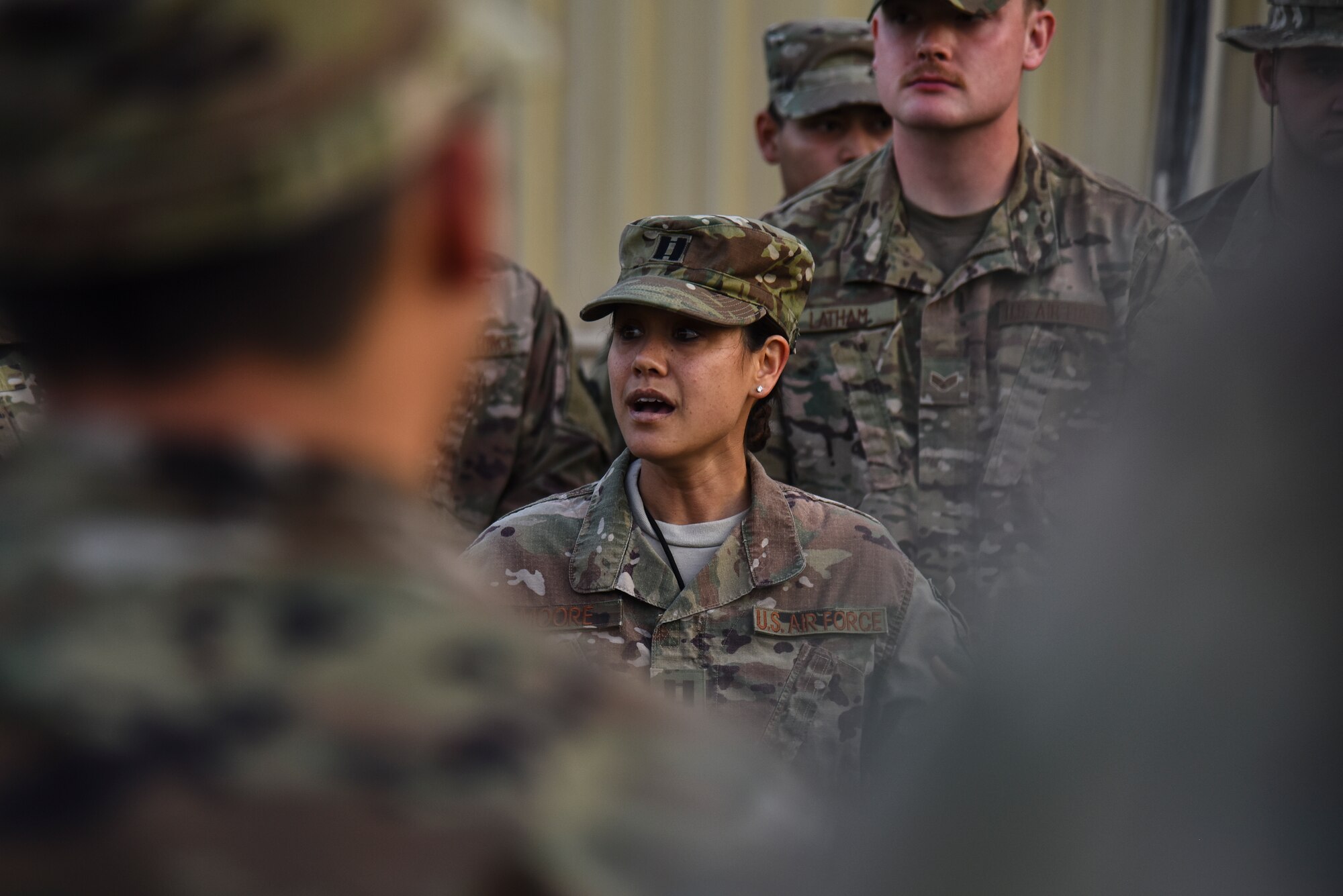 U.S. Air Force Capt. Kelly Ann Moore, 380th Expeditionary Logistics Readiness Squadron operations officer, peaks to the 380 ELRS during a tribute to the fallen ground transportation Airmen at Al Dhafra Air Base, United Arab Emirates, Nov. 8, 2018. The 380th ELRS takes the time every Thursday to make sure that the lives and legacies of the fallen Airmen continue to prevail. (U.S. Air Force photo by Senior Airman Mya M. Crosby)