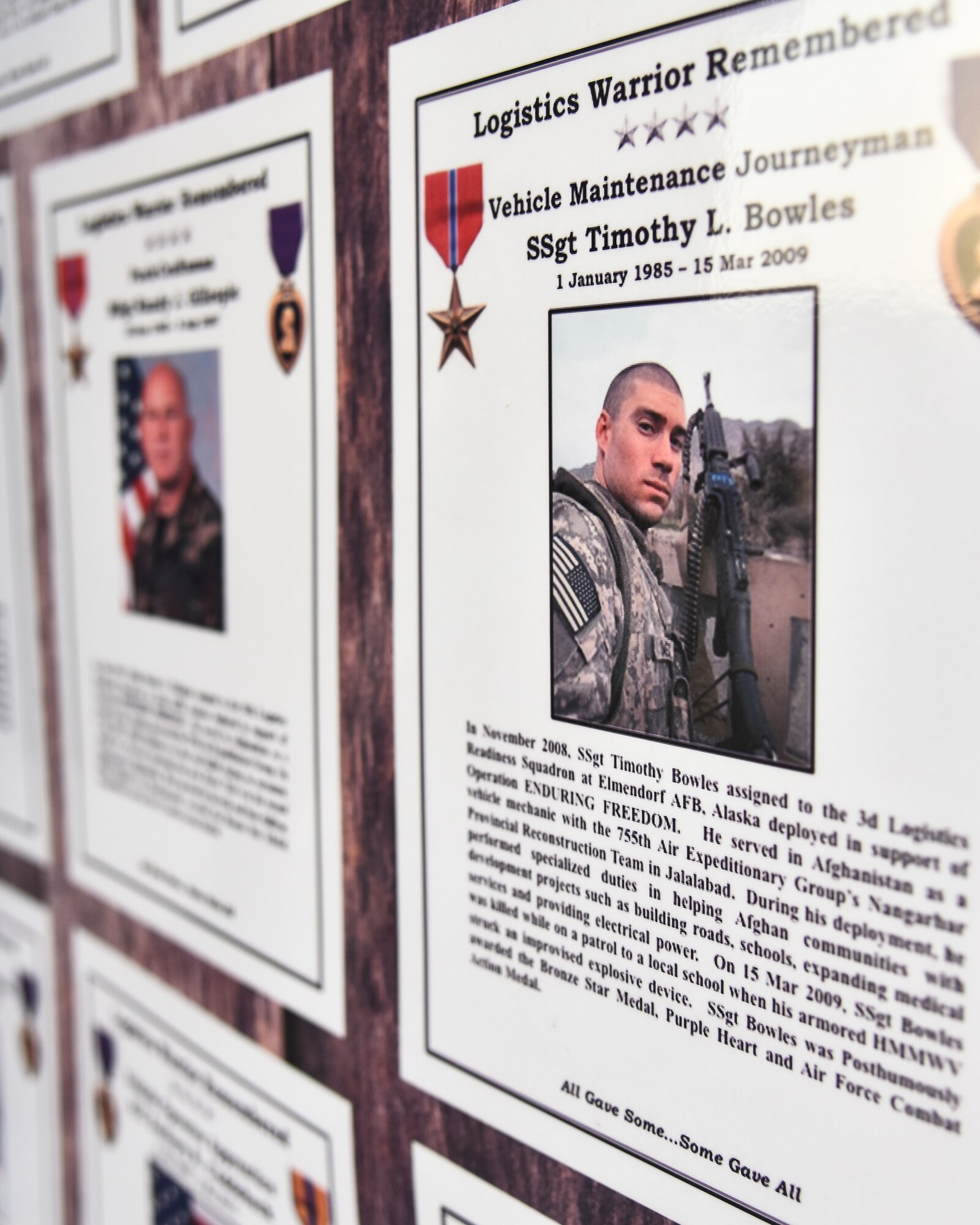 The 380th Expeditionary Logistics Readiness Squadron put together a bulletin board to remember the fallen ELRS Airmen that died downrange since Operation ENDURING FREEDOM and IRAQI FREEDOM at Al Dhafra Air Base, United Arab Emirates, Nov. 8, 2018. The fallen Airmen all ranged from Airman 1st Class to Captain, all under the age of 28 years old and were mostly killed by improvised explosive device attacks. (U.S. Air Force photo by Senior Airman Mya M. Crosby)