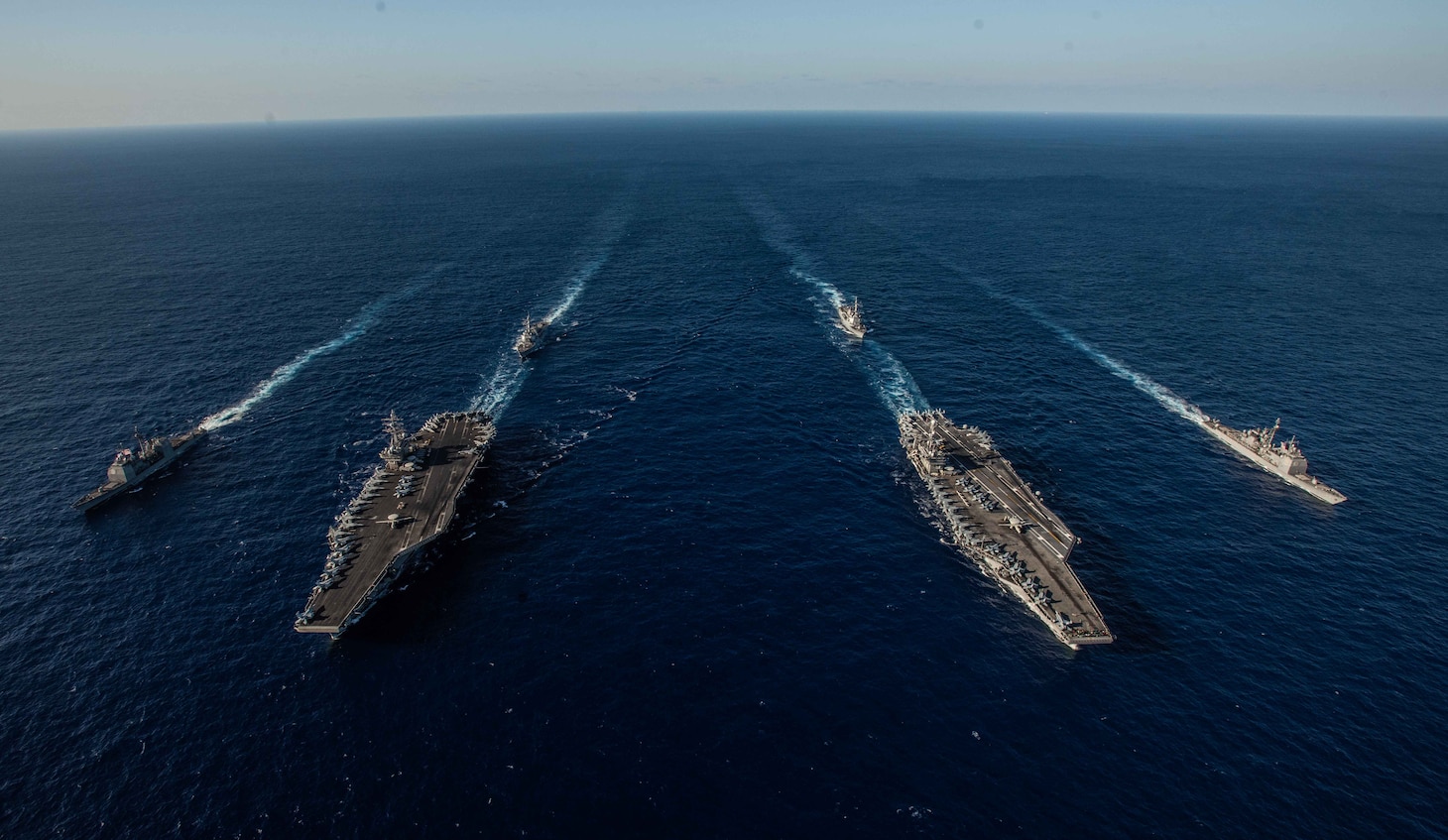 PHILIPPINE SEA (Nov. 16, 2018) Ships with the Ronald Reagan Carrier Strike Group and John C. Stennis Carrier Strike Group transit the Philippine Sea during dual carrier operations. Ronald Reagan and John C. Stennis are underway and conducting operations in international waters as part of a dual carrier strike force exercise. The U.S. Navy has patrolled the Indo-Pacific region routinely for more than 70 years promoting regional security, stability and prosperity.