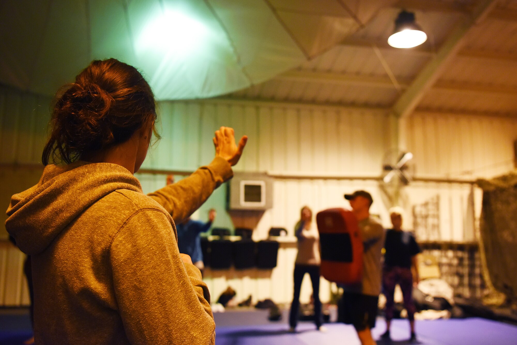 A Liberty Wing dependent practices a palm strike at a self-defense class for women by Survival, Evasion, Resistance and Escape specialist assigned to the 48th Operation Support Squadron, on Royal Air Force Mildenhall, England, Nov. 14, 2018. The SERE specialists opened up the training to 20 women of the Liberty Wing. (U.S. Air Force photo by Airman 1st Class Shanice Williams-Jones)