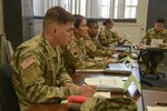 Soldiers discuss experiences and take notes during class at the Louisiana National Guard's 199th Regiment (Regional Training Institute) Basic Leadership Course at Camp Cook in Ball, Louisiana. The LANG's BLC started a new curriculum during the August rotation that will be in effect at all schoolhouses Army wide by January 2020.