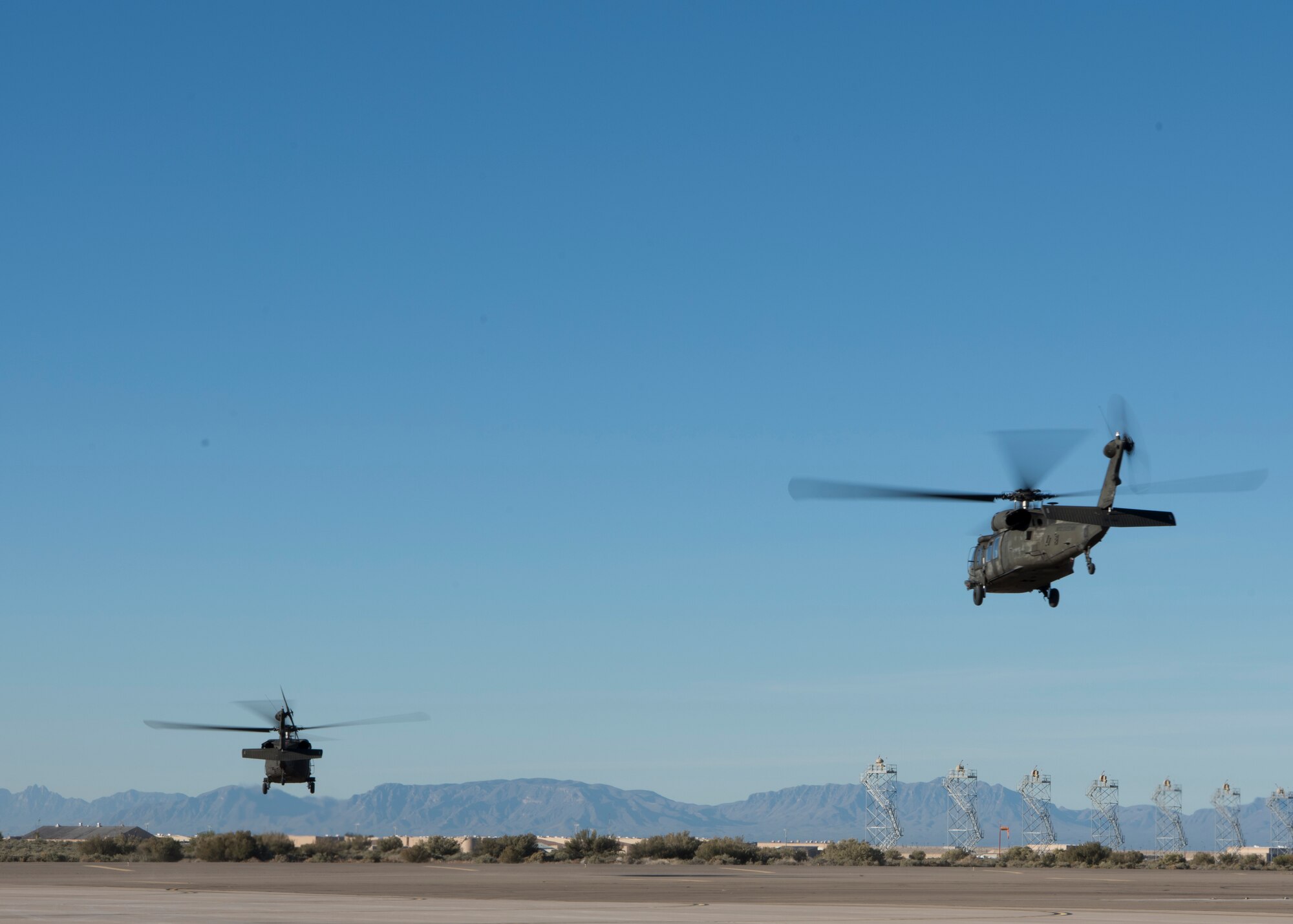 Two UH-60 Black Hawk helicopters take off of Holloman Air Force Base, N.M., November 14, 2018. Gen. Paul Selva, vice chairman of the Joint Chiefs of Staff, visited Holloman November 13 to 14, and received a helicopter tour of White Sands Missile Range, N.M. (U.S. Air Force photo by Staff Sgt. BreeAnn Sachs).