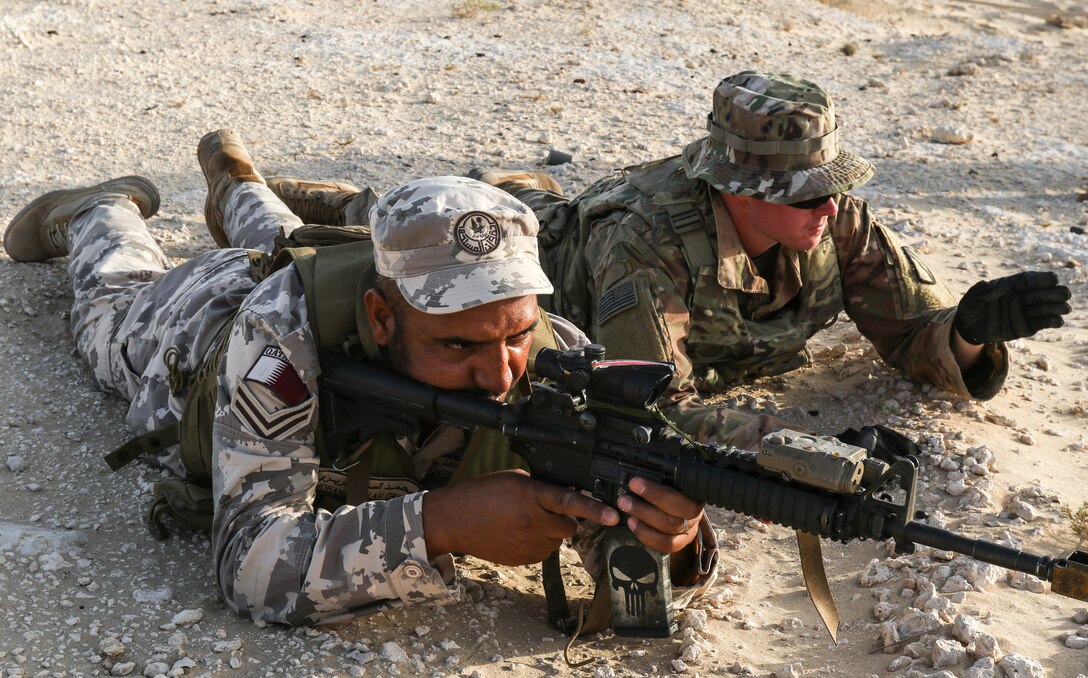 A U.S. Army Soldier assigned to 2nd Battalion, 198th Armor Regiment, 155th Armored Brigade Combat Team, Task Force Spartan, works with a Qatari soldier during bunker clearing training as part of Exercise Eastern Action 19, Nov. 7, 2018. “This exercise is one that has been taking place for several years,” said Col. Robert B. Kuth, commander of Area Support Group-Qatar, ARCENT. “Since the first iteration, we have focused upon enhancement of interoperability of land forces, as we build partnership capacity together. Both of our nations are committed to promoting security and stability, in pursuit of shared mutual interests, throughout the region.” (U.S. Army photo by Sgt. James Lefty Larimer)
