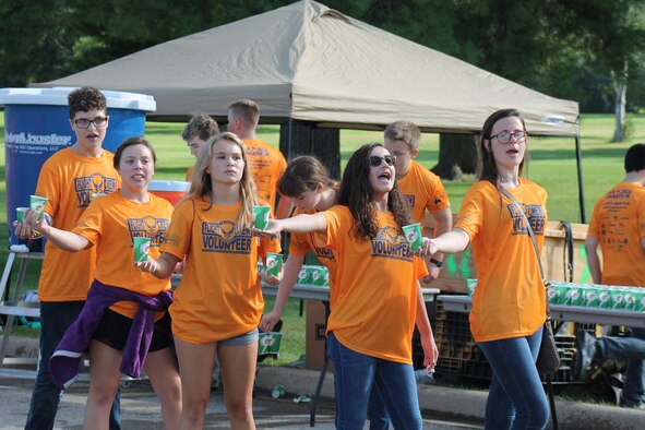 Members of the 2018 Air Force Marathon Hydration Station of the Year from Beavercreek High School Air Force Junior Reserve Officer Training Corps hand out water to runners during the 22nd Air Force Marathon September 15, 2018. (Courtesy photo)