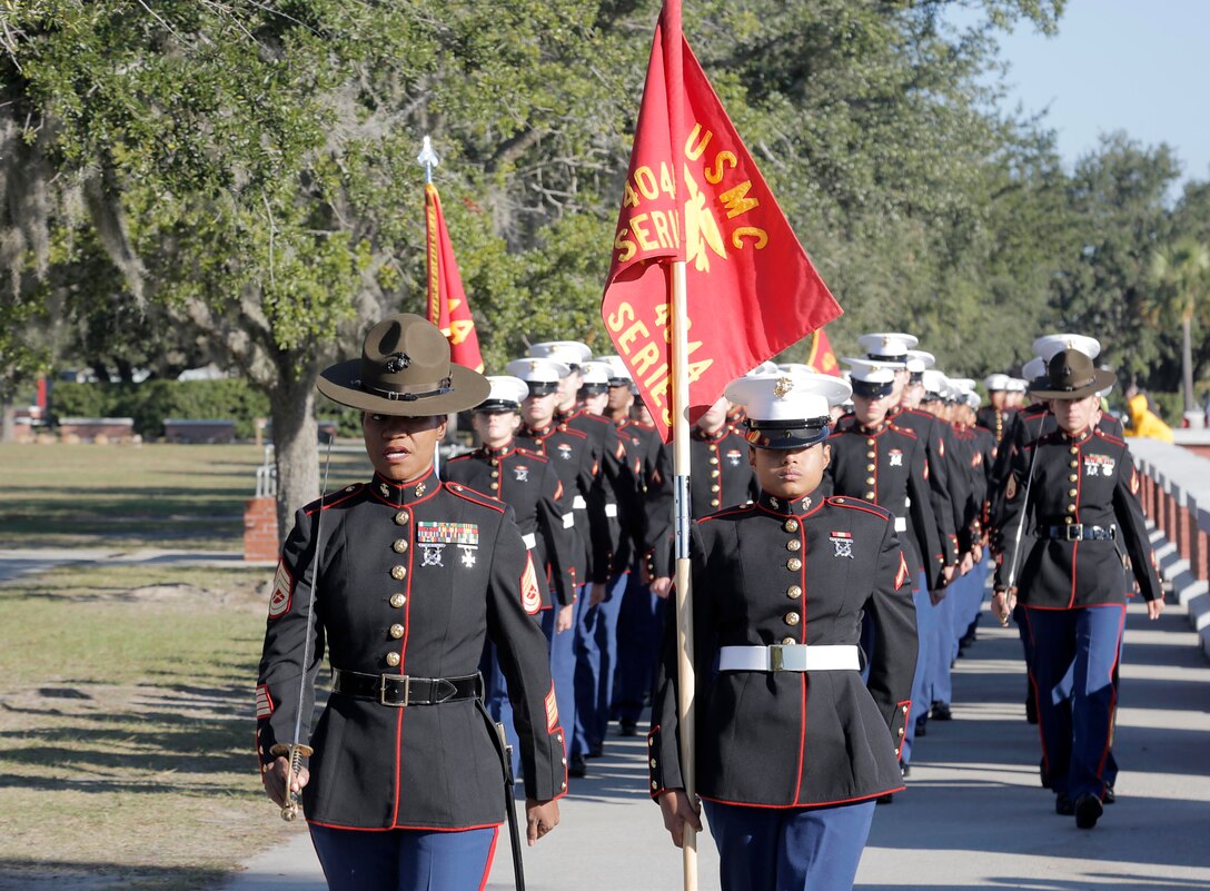 Drill Instructors and Marines with November Company, 4th Recruit Training Battalion march towards the Peatross Parade Deck before their graduation ceremony Nov. 16, 2018 at Marine Corps Recruit Depot Parris Island, S.C. (Official U.S. Marine Corps Photo by Lance Cpl. Yamil Casarreal)