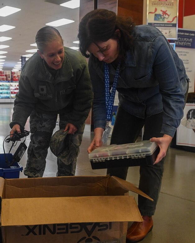 Alicia Garcia, 633rd Civil Engineer Squadron installation management flight natural resources program manager, looks through recyclable items brought in by U.S. Air Force Maj. Jennifer Palko, 733rd Logistics Readiness Squadron director of operations, during America Recycles Day at Joint Base Langley-Eustis, Virginia, Nov. 15, 2018. The 733rd Civil Engineer Division started a six-month recycling program on Nov. 1, 2018 that will end during Earth Week in April 2019. (U.S. Air Force photo by Senior Airman Derek Seifert)