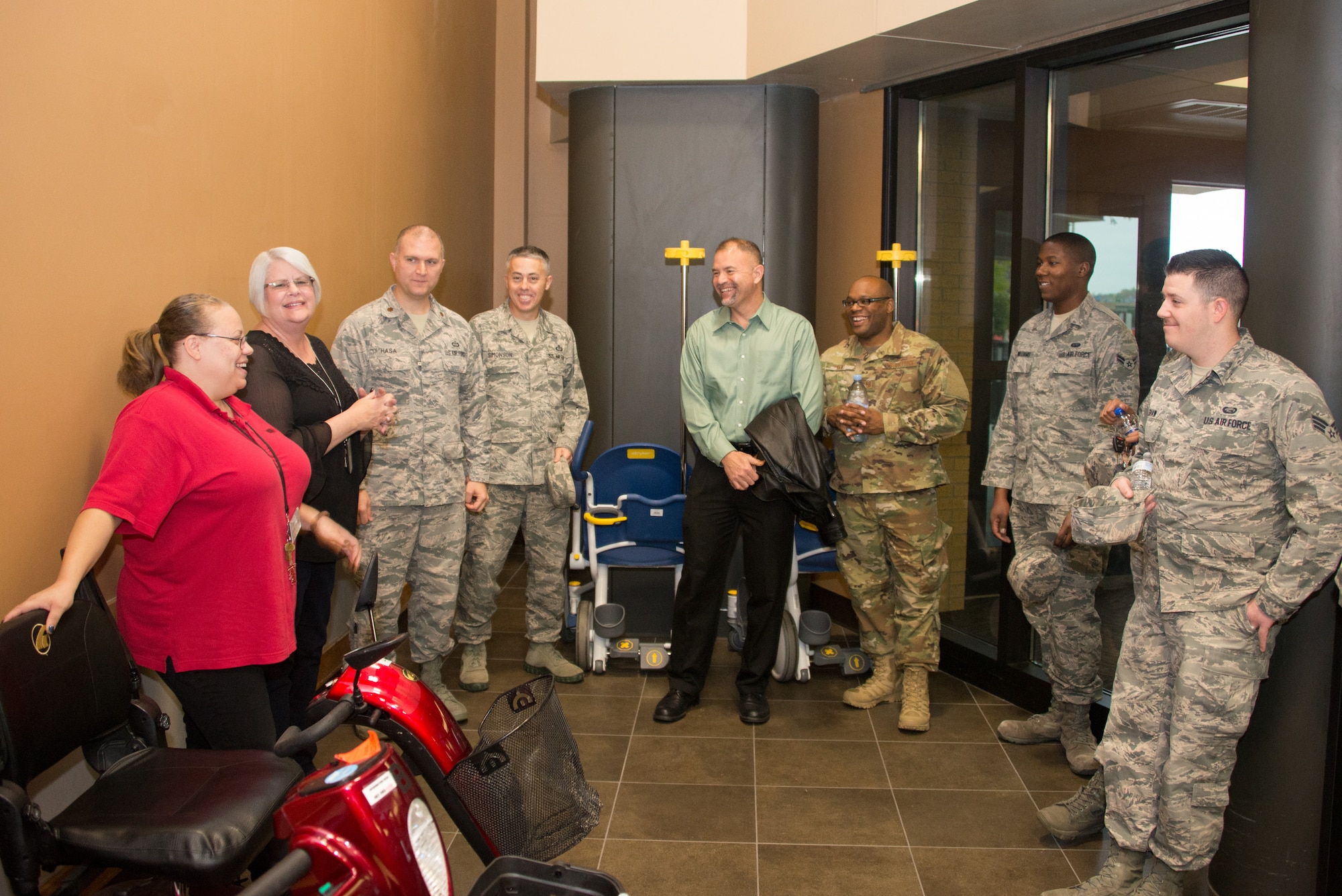 Airmen from the 2nd Weather Support Squadron (WSS) speak with staff from the Omaha Veterans Administration Medical Center in Omaha, Nebraska, Oct. 26, 2018. The Airmen visited with veterans in both the in-patient and out-patient areas of the hospital, whose military careers went back as far as World War II. (U.S. Air Force photo by Paul Shirk)