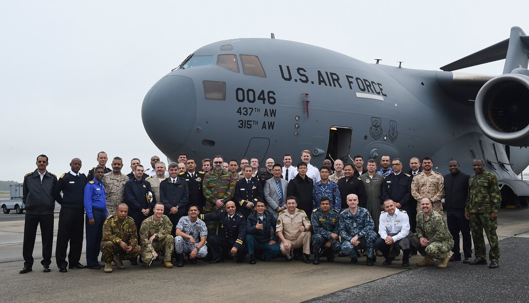 A group of Naval War College students, comprised of foreign and joint military officers, stand outside a C-17 Globemaster III aircraft during a Nov. 13, 2018, visit to Joint Base Charleston, S.C. The visit educated naval officers about air mobility operations and was the first time international students from the Naval Command College’s Arleigh Burke Fellowship program had visited JB Charleston. The NCC is part of the U.S. Naval War College, located in Newport, Rhode Island, and focuses on educating and developing future leaders by building strategic and cultural perspective and enhancing the capability to advise senior leaders and policy-makers.