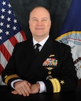 Navy Rear Adm. William Chase poses for an official photo.