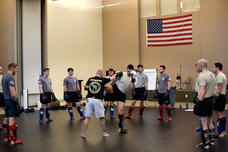 U.S Air Force Senior Airman Skyler Pendleton, 22nd Training Squadron Survival, Evasion, Resistance and Escape specialist and SERE Combatives Program instructor, demonstrates self-defense moves to other SERE specialists during a combatives class at Fairchild Air Force Base, Washington, Nov. 7, 2018. The Air Force recently implemented an advanced SERE Combatives Program to enhance SERE specialists’ capability to provide self-defense techniques and increase survivability in an unfriendly environment. (U.S. Air Force photo/Airman 1st class Jesenia Landaverde)