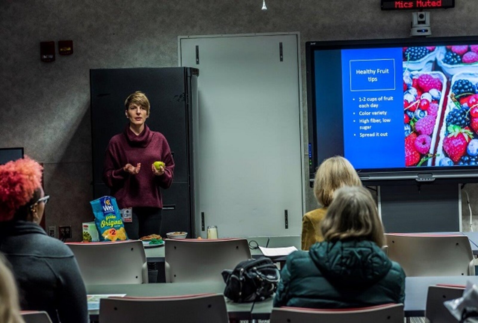 Julie Palmer teaches associates on nutrition tips during World Diabetes Day presentation